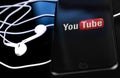 YouTube logo on the screen smartphone Royalty Free Stock Photo