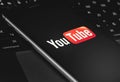 YouTube logo on the screen smartphone Royalty Free Stock Photo