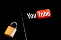 YouTube mobile logo app on screen smartphone iPhone with lock closeup Royalty Free Stock Photo