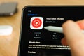 Youtube music logo shown by apple pencil on the iPad Pro tablet screen. Man using application on the tablet. December 2020, San Royalty Free Stock Photo