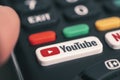 YouTube on television remote , hand holding television remote controller Royalty Free Stock Photo