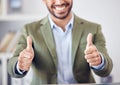 Youve been endorsed by the best. an unrecognizable businessman giving thumbs up while sitting in his office.