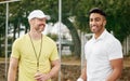 Youve got this. a handsome young male tennis player standing outside on the court with his coach. Royalty Free Stock Photo