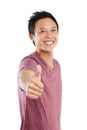 Youve got my vote. Studio portrait of a young man standing and giving a thumbs up against a white background. Royalty Free Stock Photo