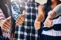 Youve got our vote. a group of unidentifiable schoolchildren showing a thumbs up outside their classroom. Royalty Free Stock Photo