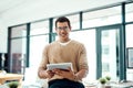 Youve got to use technology to your advantage. Portrait of a young designer working on a digital tablet in an office. Royalty Free Stock Photo