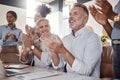 When youve made the boss happy, youve made it. a group of businesspeople clapping during a conference in a modern office Royalty Free Stock Photo