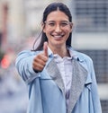 Youve made the right business decision. an attractive young businesswoman standing alone and showing a thumbs up.