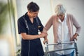 Youve walked so far already. a young female nurse assisting a senior woman walk using a walker in a nursing home. Royalty Free Stock Photo