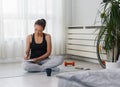 YouYoung sporty woman taking notes after exercise at home. New life resolutions list. Royalty Free Stock Photo