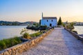 Ypapanti Church - Beautiful scenery at sunset in Gouvia Bay Ã¢â¬â small ancient white church on a pier, Corfu island, Ionian sea, Royalty Free Stock Photo