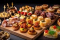 Typical snack of Basque Country, pinchos or pinxtos skewers with small pieces of bread, sea food, eggs, cheese, Royalty Free Stock Photo