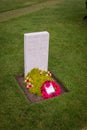 Ypres, Belgium - May 23, 2019: Portrait view of a grave at the Yypres Tyne Cot War Cemetary, Ypres, Belgium