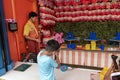 Ypung boy, not recognisable shoots at tin cans in amusement park scores hit