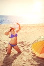 YSummer holiday, girl traveling, relax on the beach on a background of water. Fun summer party in the trip. Woman on