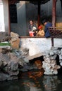 Yu Yuan Gardens, Shanghai, China: People looking at fish in a pond