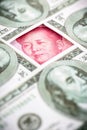 Yuan banknote, surrounded by 100 dollar bills. American market protectionism concept