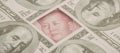 Yuan banknote, surrounded by 100 dollar bills. American market protectionism concept