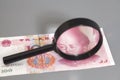 Yuan chinese money with magnifier glass