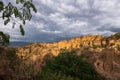 Yuanmou soil forest with full of cumulonimbus clouds Royalty Free Stock Photo