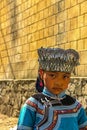 A Hani minority village girl wearing traditional headgear adornments