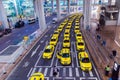 Group of yellow taxi cabs waiting arrival passengers in front of Airport Gate. Chongqing Jiangbei international airport in CHINA Royalty Free Stock Photo