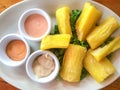 Yuca fries served on white plate with sauces Royalty Free Stock Photo