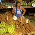 Yuca vendor at belen market, Iquitos, Peru