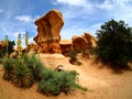 Yucca plant and hoodoos on sandstone desert landscape in Escalante, Utah