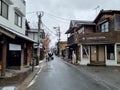 Yufuin,Japan - January 5,2023 : The vintage shopping on main street of Yufuin after snow fall in winter