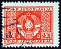 YUGOSLAVIA - CIRCA 1946: A stamp printed in Yugoslavia shows Coat of Arms of Yugoslavia, circa 1946.
