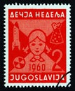 YUGOSLAVIA - CIRCA 1960: A stamp printed in Yugoslavia from the `Children`s Week` issue shows Girl`s head and toys, circa 1960.