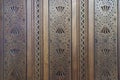 Yugoslavian brown carved heart, star, and zigzag wood wall paneling detail