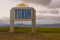 Yukon border and Trans Canada Trail sign in the arctic