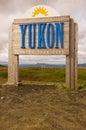 Yukon border and Trans Canada Trail sign in the arctic