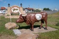 Welcome to Yukon sign along Route 66, with a cattle cow statue celebrating its centennial