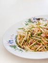 Green mango salad with shallots and shredded dried shrimp, local southern Thai food