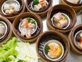 Yumcha or Dimsum, various chinese cuisine steamed dumpling in bamboo basket steamer in chinese restaurant