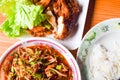 Yummy authentic Local thai food Somtum and Gaiyang, Papaya spicy salad and griled chicken with purple orchid image decorated Royalty Free Stock Photo