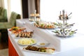 Yummy banquet meals on table with white tablecloth. Royalty Free Stock Photo