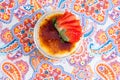 Yummy bowl of creme brulee with fresh strawberries