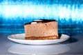 Yummy chocolate cake on blue background