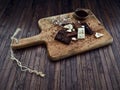 Yummy chocolates on a wooden tray, wooden background Royalty Free Stock Photo