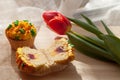 Yummy cupcake and red tulips on light background. Selective focus