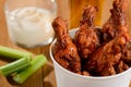 Yummy fried chicken drumsticks combined with celery sticks and ranch sauce Royalty Free Stock Photo