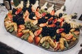 Yummy fruits table at wedding reception in restaurant, luxury ca