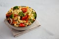 Yummy Homemade Vegan Pasta Salad with Tomato, Onion, Carrot, Broccoli, Chickpeas and Parsley in a Bowl, side view. Copy space Royalty Free Stock Photo