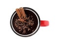 Yummy hot chocolate with cinnamon and anise in mug isolated on white, top view Royalty Free Stock Photo