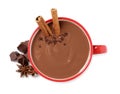 Yummy hot chocolate with cinnamon in red cup on white background, top view Royalty Free Stock Photo