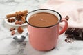 Yummy hot chocolate in mug on white marble table Royalty Free Stock Photo